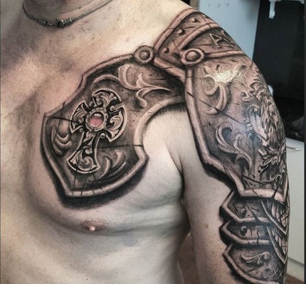Tatouages ​​pour hommes sur l'épaule: motifs slaves, celtiques, inscriptions, avec un sentiment de force et de bonté, noir et blanc et couleur